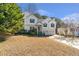 Charming two-story home with a well-manicured lawn, two car garage, and inviting front entrance at 239 Taylors Farm Dr, Canton, GA 30115