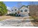 Charming two-story home with a well-manicured lawn, two car garage, and inviting front entrance at 239 Taylors Farm Dr, Canton, GA 30115