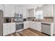 Bright kitchen with stainless steel appliances and white cabinets at 239 Taylors Farm Dr, Canton, GA 30115