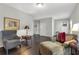 Spacious living room featuring hardwood floors, neutral paint, and comfortable seating at 239 Taylors Farm Dr, Canton, GA 30115
