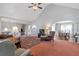 Open-concept living room featuring vaulted ceilings, seamless flow to dining area, and neutral décor at 239 Taylors Farm Dr, Canton, GA 30115