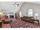Inviting living room with high ceilings, a fireplace, and lots of natural light at 239 Taylors Farm Dr, Canton, GA 30115