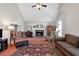 Cozy living room with fireplace, vaulted ceiling, and traditional furniture arrangement at 239 Taylors Farm Dr, Canton, GA 30115