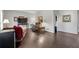 Open concept living room with hardwood flooring and contemporary furnishings at 239 Taylors Farm Dr, Canton, GA 30115