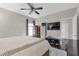 Bright bedroom with a large window, ceiling fan, and hardwood floors at 239 Taylors Farm Dr, Canton, GA 30115