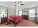 Spacious main bedroom with a coffered ceiling, a four poster bed, and dual night stands at 239 Taylors Farm Dr, Canton, GA 30115