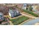A high-angle shot highlighting the home's layout, driveway, manicured landscaping, and surrounding trees at 349 Azalea Chase Dr, Suwanee, GA 30024