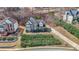 An aerial perspective displays the home's setting, long driveway, and manicured lawn with surrounding greenery at 349 Azalea Chase Dr, Suwanee, GA 30024