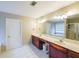 Bathroom featuring double vanity, shower, tub, white tiled floors, and neutral walls at 349 Azalea Chase Dr, Suwanee, GA 30024