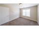 Bedroom with a large window for plenty of natural light and neutral carpet flooring at 349 Azalea Chase Dr, Suwanee, GA 30024