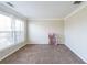 Bright, carpeted bedroom with a large window and plenty of space at 349 Azalea Chase Dr, Suwanee, GA 30024