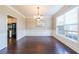 Bright dining room with wainscotting, dark wood floors and natural light at 349 Azalea Chase Dr, Suwanee, GA 30024