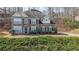 Charming brick two-story home with well-manicured landscaping and a welcoming facade in a lovely neighborhood at 349 Azalea Chase Dr, Suwanee, GA 30024