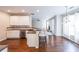 Spacious kitchen that opens to the living room, featuring stainless steel appliances and hardwood flooring at 349 Azalea Chase Dr, Suwanee, GA 30024