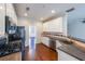 Kitchen featuring black appliances, dark countertops, and white cabinetry with hardwood flooring at 349 Azalea Chase Dr, Suwanee, GA 30024