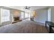 Spacious living room with fireplace, carpet and an open floor plan at 349 Azalea Chase Dr, Suwanee, GA 30024