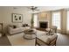 Cozy living room with fireplace, comfortable seating, and neutral tones at 349 Azalea Chase Dr, Suwanee, GA 30024