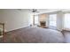 Open and spacious living room with a brick fireplace and lots of natural light at 349 Azalea Chase Dr, Suwanee, GA 30024