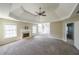 Large primary bedroom with trey ceilings, large windows for natural light, and a fireplace at 349 Azalea Chase Dr, Suwanee, GA 30024