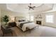 Spacious main bedroom with tray ceiling, fireplace and plenty of natural light at 349 Azalea Chase Dr, Suwanee, GA 30024