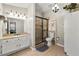 Bathroom featuring granite countertops, a glass enclosed shower, and a large vanity at 815 Riverstone Ln, Woodstock, GA 30188