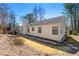 View of the home's backyard and rear exterior at 815 Riverstone Ln, Woodstock, GA 30188