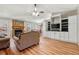 Inviting living room with a fireplace, built-in shelving, and seamless access to the dining area at 815 Riverstone Ln, Woodstock, GA 30188