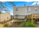 Backyard view showcasing a deck with wood railings at 858 Heritage Valley Rd, Norcross, GA 30093