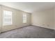 Bright bedroom with carpeting and natural light from two windows at 858 Heritage Valley Rd, Norcross, GA 30093