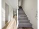 Inviting entryway with durable wood flooring and a staircase leading to the upper level at 858 Heritage Valley Rd, Norcross, GA 30093