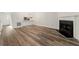 Spacious living room featuring modern flooring and a cozy fireplace at 858 Heritage Valley Rd, Norcross, GA 30093