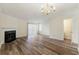 Bright living room featuring neutral walls, fireplace, laminate floors, and ample space at 858 Heritage Valley Rd, Norcross, GA 30093
