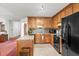 Well-lit kitchen boasts ample cabinet space, essential appliances, and a view into the living area at 2935 Pruitt Rd, Cumming, GA 30041