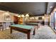 Billiard room with two pool tables, a bar, and plenty of seating at 1280 W Peachtree Nw St # 2302, Atlanta, GA 30309