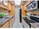 Galley kitchen with stainless steel appliances, granite countertops, and ample cabinet space at 1280 W Peachtree Nw St # 2302, Atlanta, GA 30309