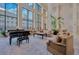 Grand lobby featuring high ceilings, a piano, comfortable seating, and natural light at 1280 W Peachtree Nw St # 2302, Atlanta, GA 30309