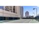 Outdoor tennis court with city views and well-maintained fencing at 1280 W Peachtree Nw St # 2302, Atlanta, GA 30309