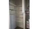 Utility closet contains a water heater and shelving at 159 Cedar Ridge Trl, Lawrenceville, GA 30046