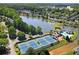 Aerial view showcases the community with a lake, pool and tennis courts at 2540 River Summit Dr, Duluth, GA 30097