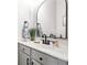 Bathroom vanity with modern sink and fixtures plus a large decorative mirror at 2540 River Summit Dr, Duluth, GA 30097