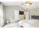 Bedroom features a high ceiling, modern ceiling fan, and an en-suite bathroom at 2540 River Summit Dr, Duluth, GA 30097