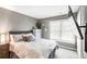 Serene bedroom featuring a tufted headboard, natural light, and contemporary decor at 2540 River Summit Dr, Duluth, GA 30097