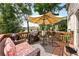 Relaxing outdoor deck with a grill, umbrella, and comfortable seating at 2540 River Summit Dr, Duluth, GA 30097