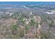 Aerial view of the home's property line amid beautiful, lush, dense trees at 2915 Pruitt Rd, Cumming, GA 30041