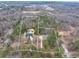 An aerial view of two properties features each home's property line amid beautiful, lush, dense trees at 2915 Pruitt Rd, Cumming, GA 30041