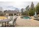 Backyard featuring pool, patio, and outdoor dining area for entertaining guests at 2915 Pruitt Rd, Cumming, GA 30041