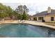 Backyard featuring pool, sun loungers, patio and partial view of home's rear exterior at 2915 Pruitt Rd, Cumming, GA 30041