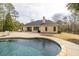 Backyard featuring pool, sun loungers, patio and partial view of home's rear exterior at 2915 Pruitt Rd, Cumming, GA 30041