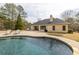 Backyard featuring pool, sun loungers, patio and partial view of home's rear exterior at 2915 Pruitt Rd, Cumming, GA 30041