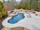 Beautiful backyard swimming pool with an attached hot tub and patio area, great for entertaining at 2915 Pruitt Rd, Cumming, GA 30041